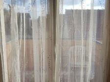 Rideaux voilages dorés Heytens pour portes-fenêtres