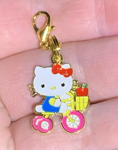 Gold hello kitty riding - hello,