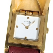 Mouvement à quartz blanc HERMES Meador Medor, bracelet doré, cadran rouge...