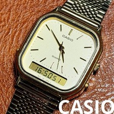 Rare montre carrée analogique numérique Casio AQ-422 testée couleur or 1997