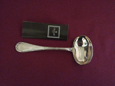 1  cuillère a sauce en métal