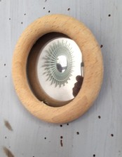 mini oeil de sorcière en bois brut.