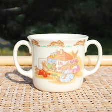 Tasse Royal Doulton en porcelaine vintage modèle Bunnykins / double anse