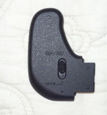 SONY DSC-H300 - couvercle de batterie