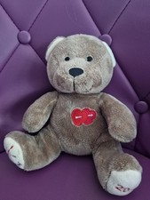 Doudou ours NOCIBE 2018 beige coeur rouge Nocibé 21 cm assis peluche 