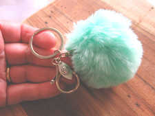 Porte clés Bijou de sac pompon fourrure vert tendre breloque Aztèques soleil