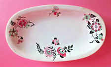 Ravier forme ovale, fleurs stylisées, tons roses Raynaud Céralène à Limoges