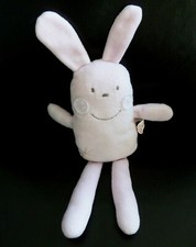 T12. DOUDOU SEMI PLAT FLEURUS PRESSE LAPIN ROSE  ETOILE FLEUR ROND BLANC TTBE