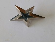 Broche «  étoile « THIERRY MUGLER tres bon état 