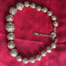 Collier EN  Métal Doré Composé de Boules à Décor de Spirales YVES SAINT LAURENT