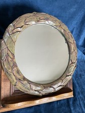 Miroir circulaire à décor de feuilles 