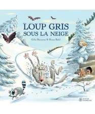 Loup gris sous la neige