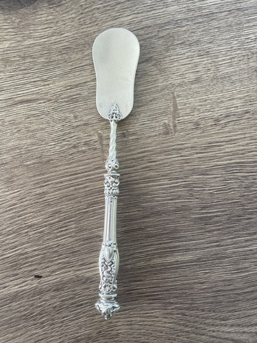 Ancienne saupoudreuse pelle