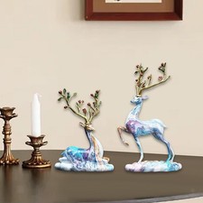 Statues de cerfs assis et