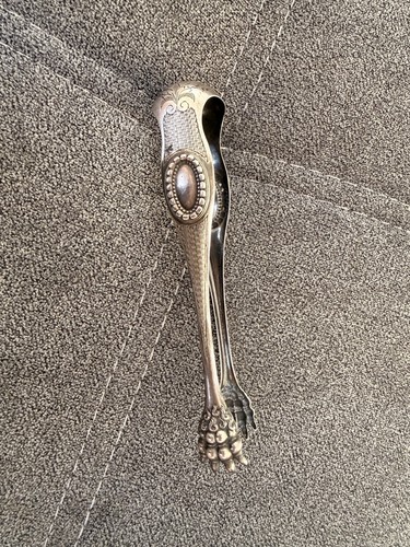 Pince sucre métal argenté - à,
