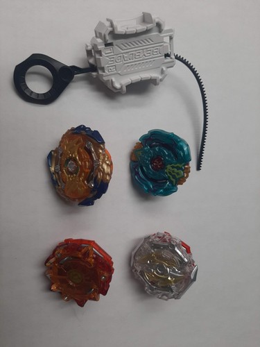 Beyblades and launcher - 4,
