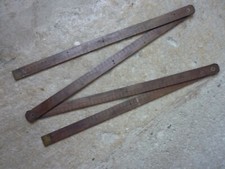 Ancien double mètre pliant à 4 éléments en bois et laiton.