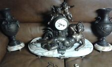 Pendule de cheminee avec garniture en regule la nymphe surprise de F Moreau  