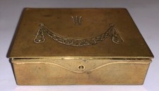 A nice Arts & Crafts brass stamp box with three stamp compartments with flower..