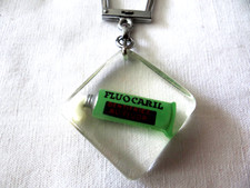 porte clés Bourbon FLUOCARIL dentifrice soins beauté santé dentition années 60