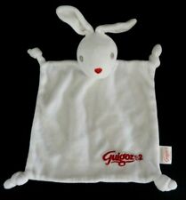 *. DOUDOU PLAT GUIGOZ 2 LAPIN BLANC NEZ ROUGE 4 NOUETTES TTBE