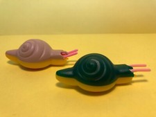 L20  :  2 figurines Maraja  année ? - Escargots roulants