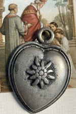 Médaillon en argent cœur surmonté d’une fleur bijou breton artisanat celtique