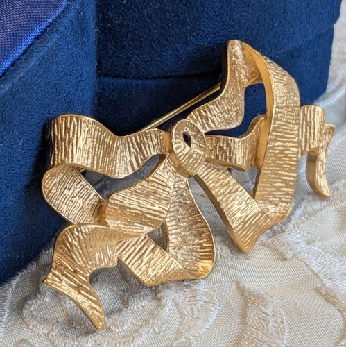 Broche ruban doré nina ricci - broche,