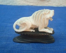 Voir okimono lion sculpté - a,