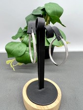 Boucles d'oreilles Swarovski creoles ovales demi pavé de stress