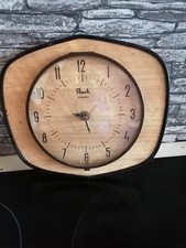  Pendule formica 1950 60  flash  en fonction