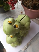 Une tirelire fantaisie motil grenouilles en bon état