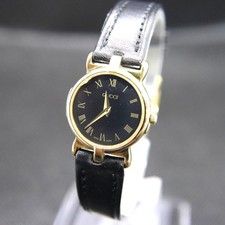 Montre Gucci 3400L femme 22 mm noire ronde vintage or quartz fabriqué en Suisse