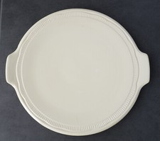 Plat rond à anses en faïence de Sarreguemines DV