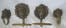 Lot 4 paternes,crochets décor tête de lion , porte torchons ,serviettes , bronze