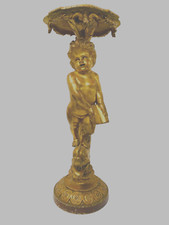 selette en bois sculpté et doré figurant un putto finement sculptée .XIX siècle.