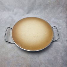 Chauffe plat vintage Silit - design épuré en métal émaillé beige et noir