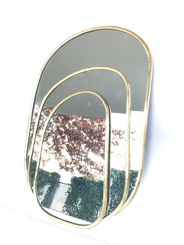 Miroir oval doré laiton