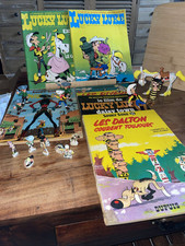 Rare Lot Bd Lucky Luke Souples dont Années 60 & Figurines Brabo + Fèves + Quick