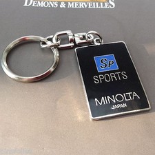 Pin's Folies *** Photo  Keychain  Minolta sports version 2