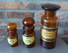 3 pots de pharmacie vintage en verre ambré