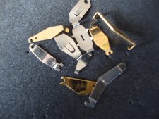 Lot de 10 brides de pile pour mouvement à quartz toutes différentes