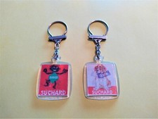 2 ANCIENS PORTE CLÉ VISIOMATIC BONBON SUGUS SUCHARD CHOCOLAT CHIEN SAINT BERNARD