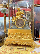 ancienne pendule en bronze a fil  romantique  debut XIXe jeune garson et chien