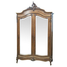 Grande armoire en placage de palissandre galbée sur les cotés