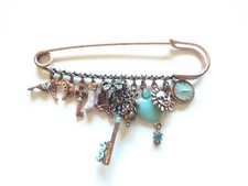 Joli et rare bijou épingle à