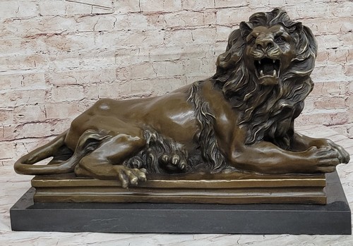 énorme livre bronze lion - livre,