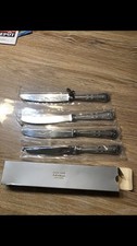 4 couteaux métal argenté
