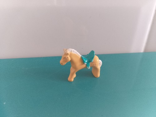 Polly pocket figurine doll