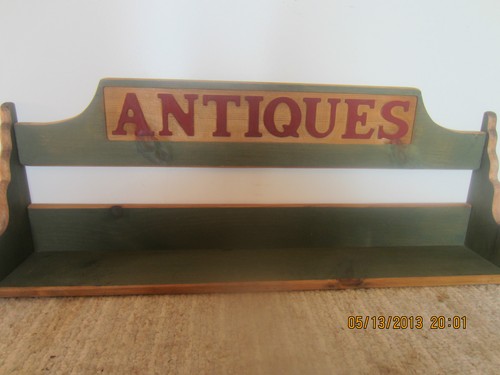 Wooden shelf has carved - has,